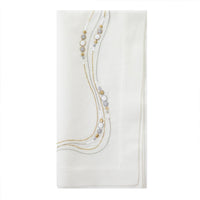The Bodrum Drift Flow Napkin Gold & Silver Set of 4 features white cotton ramie napkins with elegant gold and silver embroidered lines and circles along one corner, shown on a plain white background.