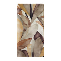 The Bodrum Flora Napkin Set of 4 features folded rectangular cotton napkins with an abstract leaf design in earthy browns, beige, gold, and muted orange on white—perfect for a fall tablescape.