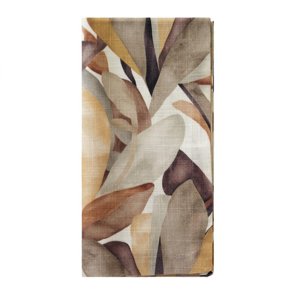 The Bodrum Flora Napkin Set of 4 features folded rectangular cotton napkins with an abstract leaf design in earthy browns, beige, gold, and muted orange on white—perfect for a fall tablescape.