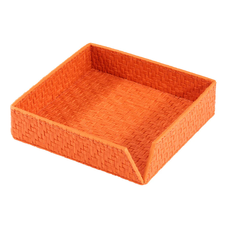 The Bodrum Wicker Cocktail Napkin Holder is a square orange basket tray with an open front edge, made from phthalate-free vinyl resembling woven straw, ideal for holding napkins or small items.