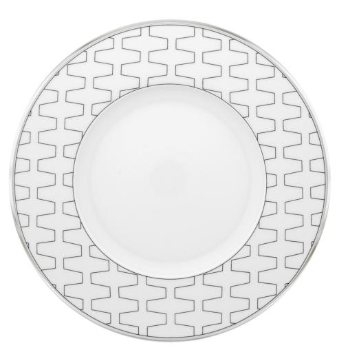 The Vista Alegre Trasso Dinnerware plate features a wide rim with a geometric silver pattern, inspired by Trasso porcelain. Its center is plain, making it ideal for enhancing any geometric platinum table setting.