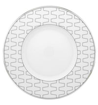 The Vista Alegre Trasso Dinnerware plate features a wide rim with a geometric silver pattern, inspired by Trasso porcelain. Its center is plain, making it ideal for enhancing any geometric platinum table setting.