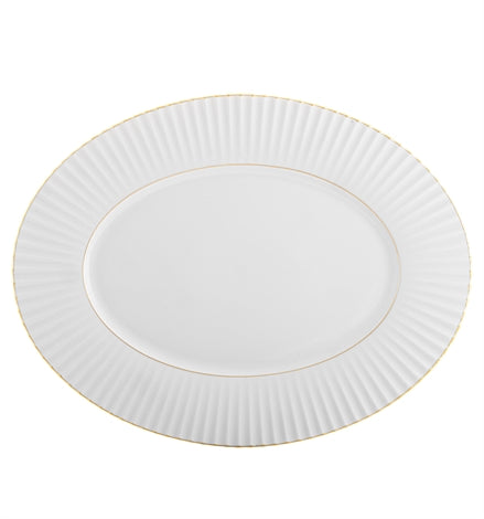 The 200 Anos Dinnerware by Vista Alegre is an oval white porcelain plate with a fluted textured rim and hand-painted gold trim—ideal for adding modern elegance to any luxurious dinnerware set.