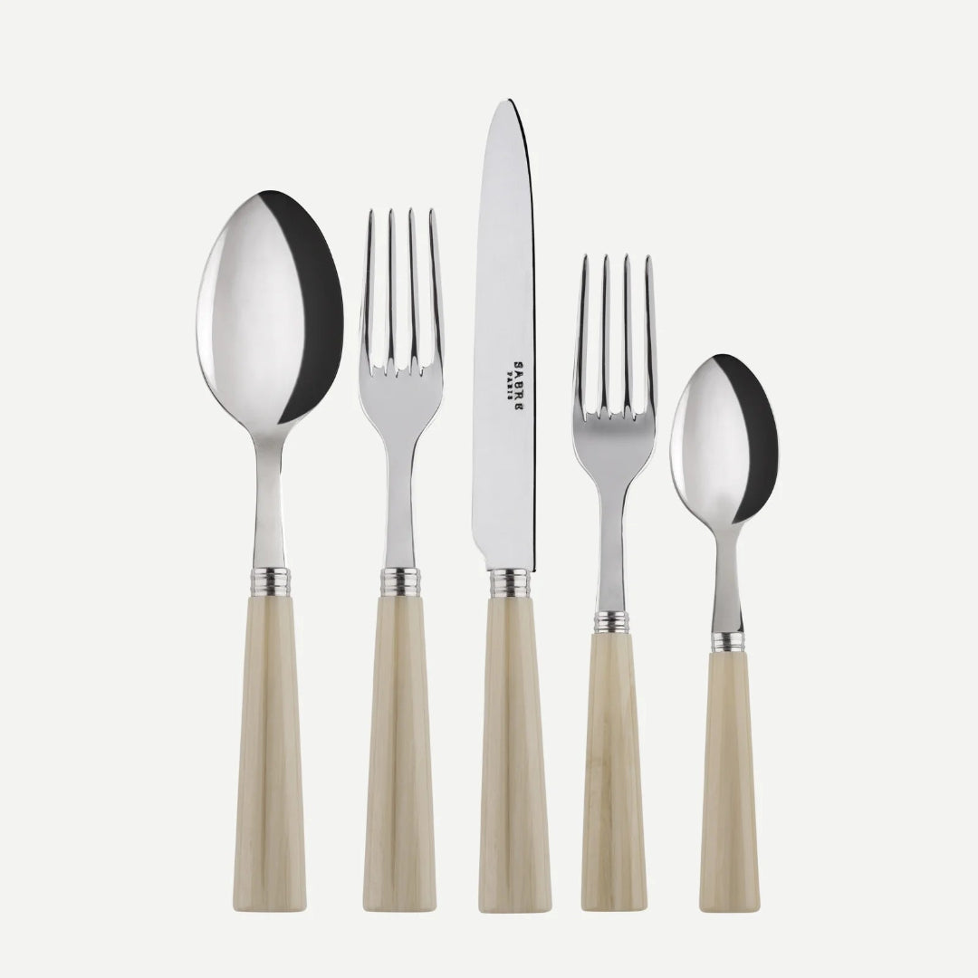 The Sabre Nature Flatware 5 Piece Setting - Faux Horn includes a large spoon, dinner fork, dinner knife, salad fork, and small spoon with shiny metal tops and light beige handles, made in France.