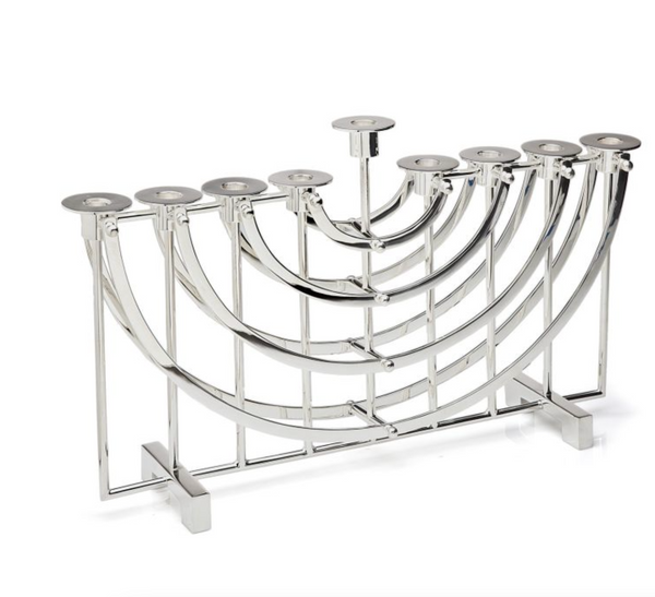 The Ricci Nickel Suspension Menorah features a modern geometric design with nine candle holders in a symmetrical, arched arrangement on a rectangular base—a striking piece of Jewish tradition.