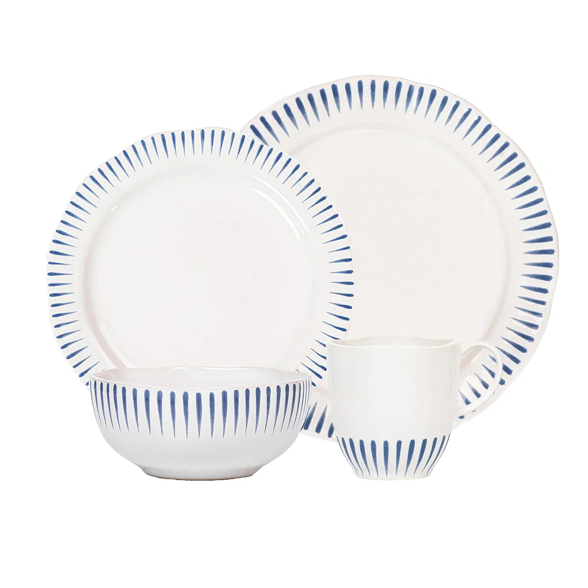 Certainly! Here’s a rewritten version using the product data: A set of four white ceramic dishes from Juliska’s Sitio Stripe Dinnerware - Delft Blue collection—a bowl, a mug, a medium plate, and a dinner plate—each adorned with vertical blue lines around the rim inspired by classic Delft blue design.