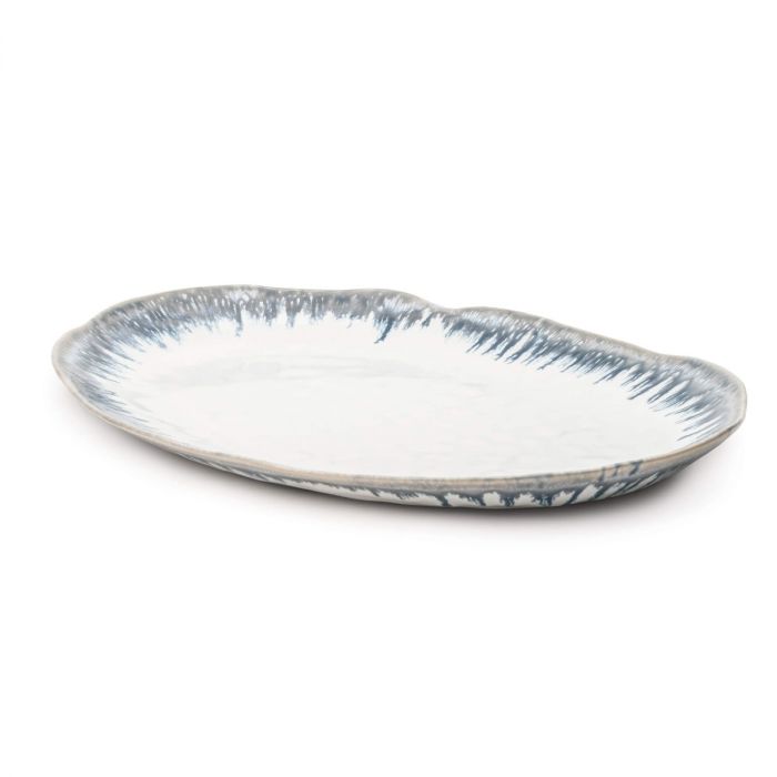 The Simon Pearce Burlington Dinnerware Pool ceramic oval platter features a wavy, glazed edge with a white glaze and blue-gray brushstroke accents—an elegant addition to your pottery or Burlington collection.