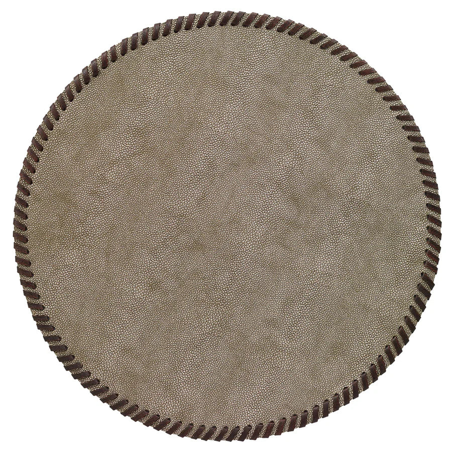 The Bodrum Whipstitch Round Placemat Set of 4 features taupe-colored, phthalate-free vinyl mats with dark brown stitched borders, seen from above on a white background.