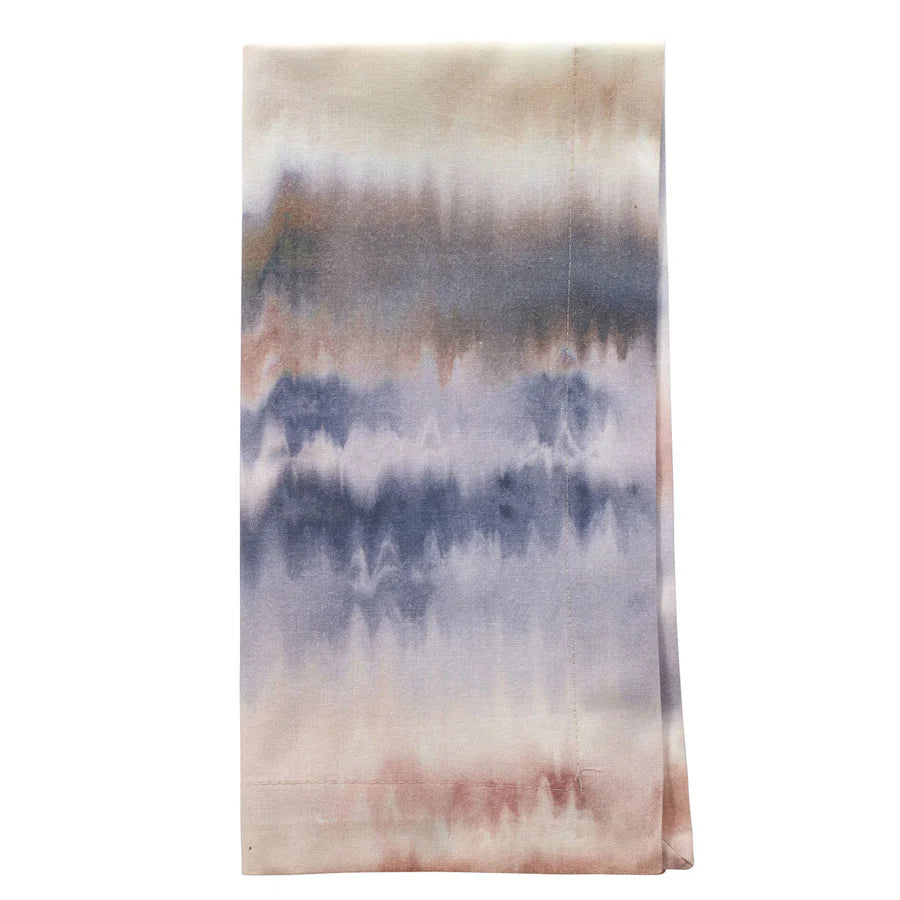 The Aria Napkin Lake Set of 4 by Bodrum features machine washable cloth napkins with a soft tie-dye pattern in blue, mauve, and beige tones plus subtle zigzag designs—ideal for bringing style to your holiday table.