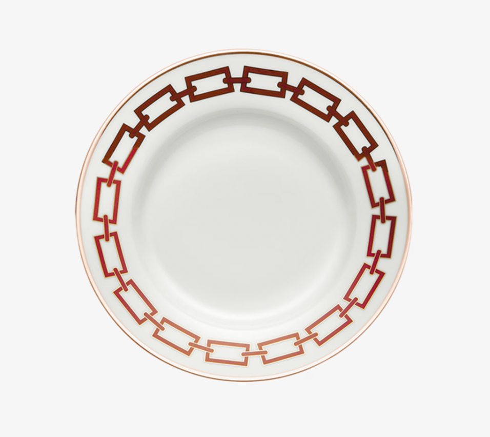 A Catene Scarlatto Dinnerware plate by Ginori 1735, in white porcelain with a striking red and gold chain-link rim design inspired by Gio Ponti, shown from above on a white background.