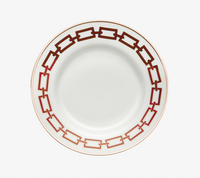 A Catene Scarlatto Dinnerware plate by Ginori 1735, in white porcelain with a striking red and gold chain-link rim design inspired by Gio Ponti, shown from above on a white background.