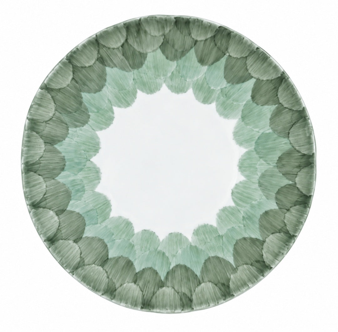 Marie Daâge Cercle d’Ecailles dessert plate, hand-painted with a central white circle surrounded by a scalloped, overlapping scale pattern in shades of sage and forest green.