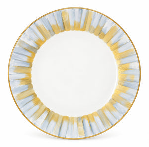 Marie Daâge Panache white Limoges porcelain dinner plate with a gold-rimmed edge and a border of vertical, brushed blue and gold stripes.