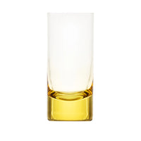 The Moser Whiskey Set Highball 400 ml is a clear, tall glass with a thick yellow base, crafted from lead-free crystal. Shown empty on a white background, it features a modern, minimalist design.