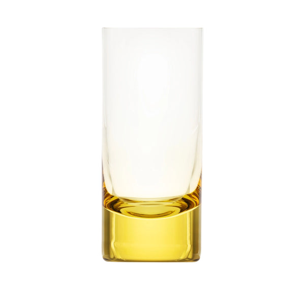 The Moser Whiskey Set Highball 400 ml is a clear, tall glass with a thick yellow base, crafted from lead-free crystal. Shown empty on a white background, it features a modern, minimalist design.