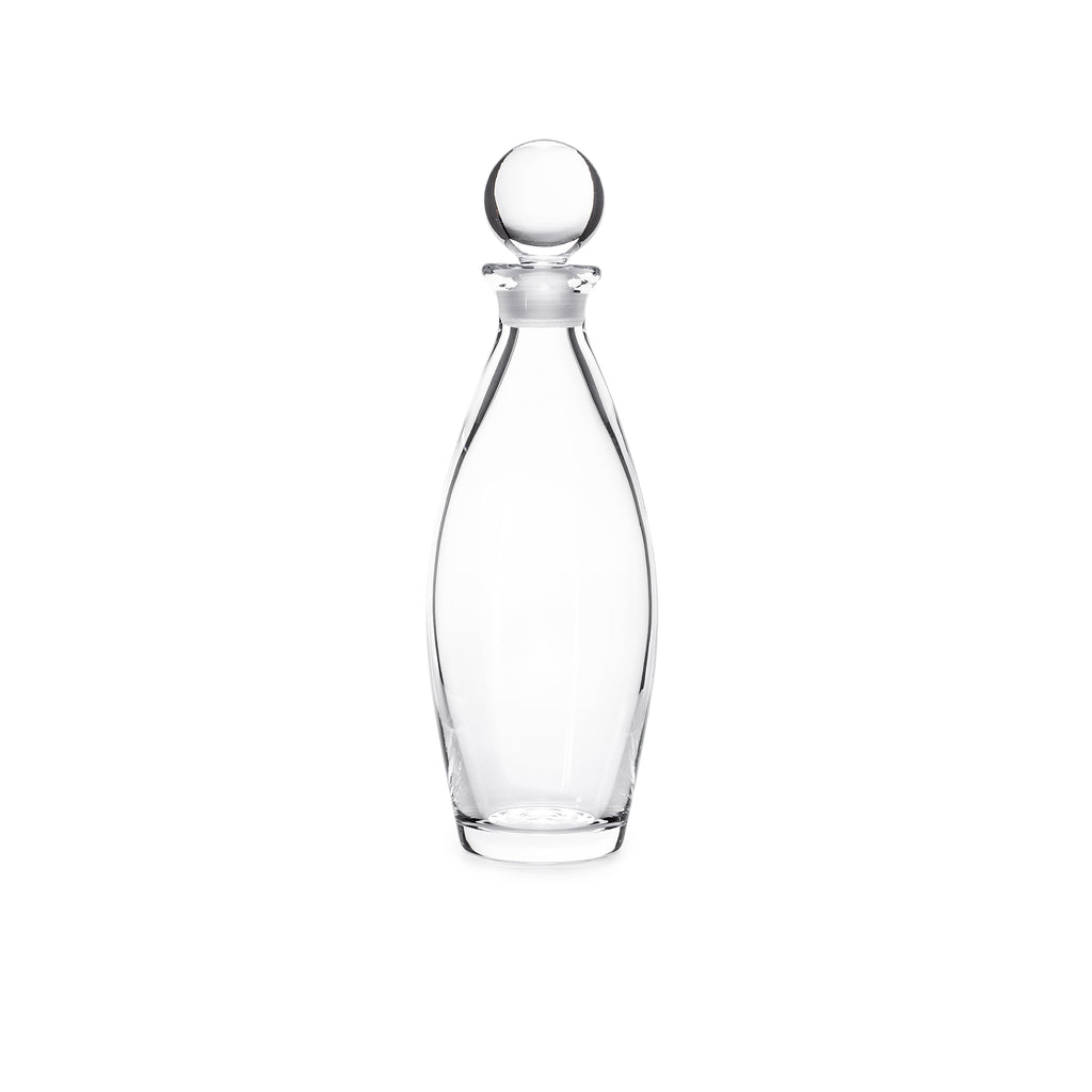 The Addison Decanter by Simon Pearce features a smooth, curved glass body and a round stopper. Displayed upright on a white background, this empty decorative decanter is an elegant addition to any barware collection.