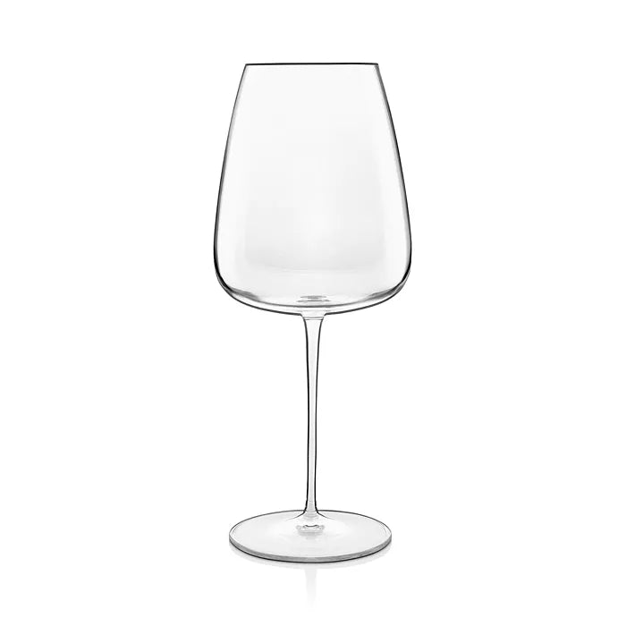 A single empty clear wine glass with a long stem and wide bowl, standing upright on a white background, highlights the elegant design of the Luigi Bormioli Talismano Bar Collection Sets.