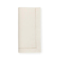 The Sferra Festival Napkin Set of 4 features neatly folded, off-white European linen napkins with simple hemstitch borders, displayed against a plain white background.