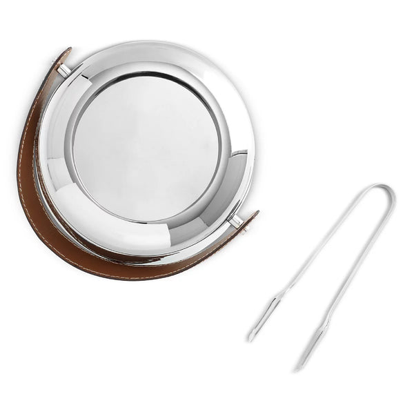 The Nambe Tahoe Ice Bucket w/ Tongs features a sleek stainless steel design and a brown leather handle, making it a stylish addition to your home bar accessories.