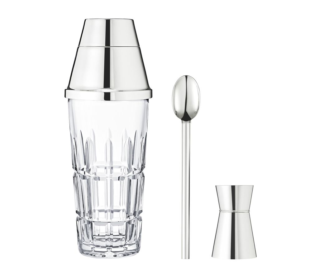 The Saint-Louis/Hermes Manhattan Mixology Set features a clear glass cocktail shaker with a metal lid, a long stirring spoon, and a jigger—essential bartender tools and an ideal gift set for cocktail lovers.
