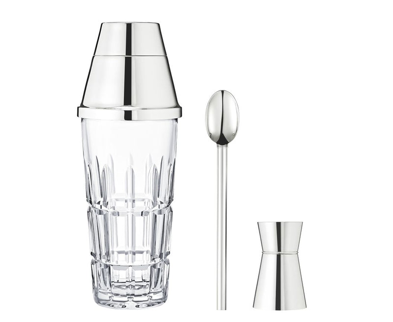 The Saint-Louis/Hermes Manhattan Mixology Set features a clear glass cocktail shaker with a metal lid, a long stirring spoon, and a jigger—essential bartender tools and an ideal gift set for cocktail lovers.