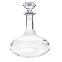 The Saint-Louis/Hermes Oxymore Wine Decanter, featuring clear glass with a round base, long neck, and decorative stopper, sits empty on a white background—an elegant touch for any tableware collection.