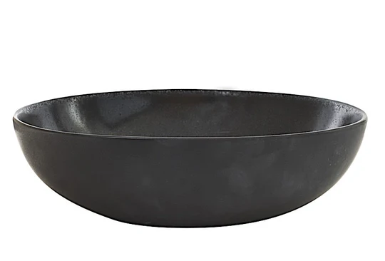 The Tourron Dinnerware Celeste by Jars - Rosenthal is a shallow, round, matte black ceramic bowl with a smooth surface, shown against a plain white background.