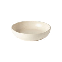 The Costa Nova Pacifica Vanilla Dinnerware features a simple, round, shallow bowl with a smooth, off-white speckled finish, displayed on a plain white background.
