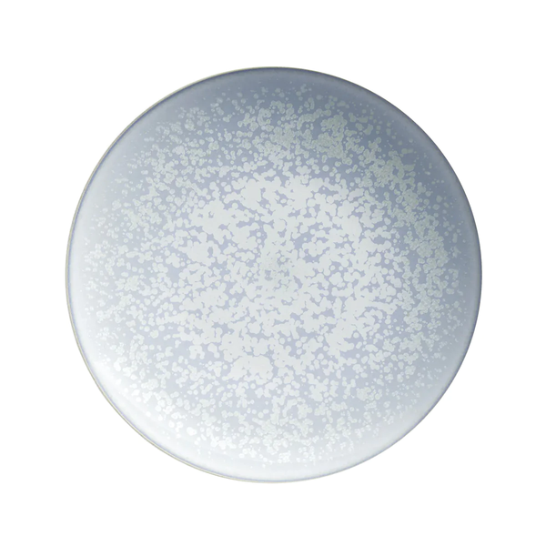 The Song Ocean Dinnerware by Jaune De Chrome is a round ceramic plate, seen from above, with a light grey and white speckled pattern radiating from the center—evoking classic French style.