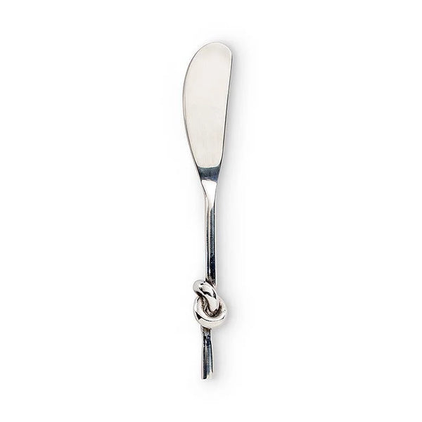 The Inspired Generations Knotty Spreader Knife, crafted from stainless steel and featuring a simple design with a decorative knot in the handle, is elegantly photographed on a white background—making it perfect for serving as both a butter knife and spreader.