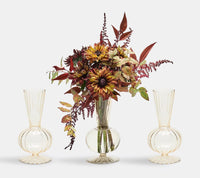 The Kim Seybert Tess Bud Vase Set of 4 in Champagne features hand-blown vases, displayed with autumn-inspired floral decor against a plain white background.