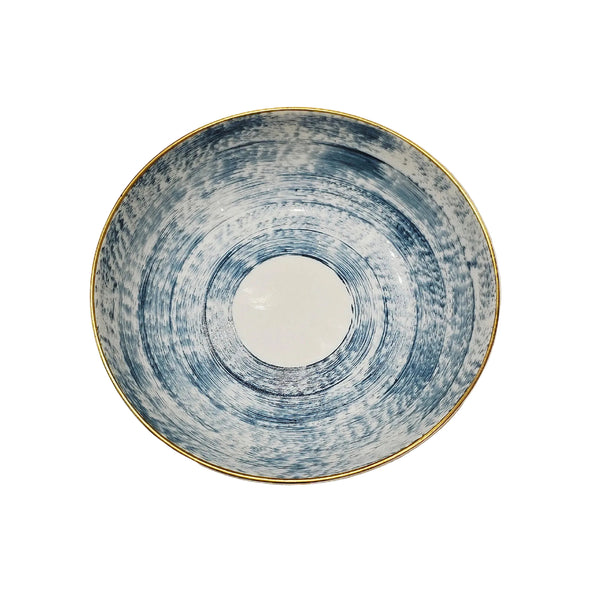A round ceramic bowl from the Marie Daage Agate Dinnerware collection by Marie Daâge, featuring a white center, blue textured circular pattern, and a thin gold rim—evocative of exquisite French porcelain tableware.