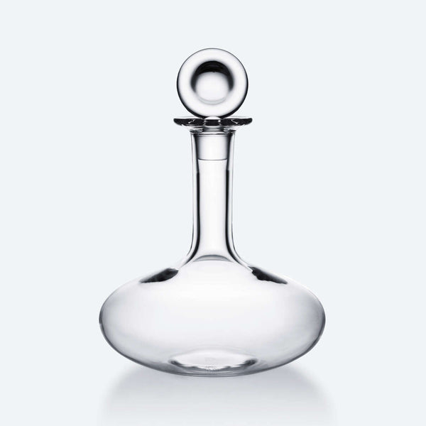 The Baccarat Oenologie Decanter by Baccarat features a clear crystal design with a wide, round base and tall, narrow neck topped by a spherical stopper—a sophisticated wine aerator for refined tasting experiences.