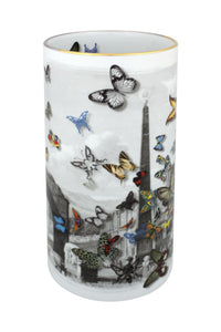 The Large Forum Vase by Christian Lacroix for Vista Alegre is a cylindrical porcelain vase adorned with a black-and-white cityscape and vibrant, multicolored butterflies of various sizes. A delicate gold line accents the rim, lending the piece an elegant finish characteristic of Vista Alegre craftsmanship.