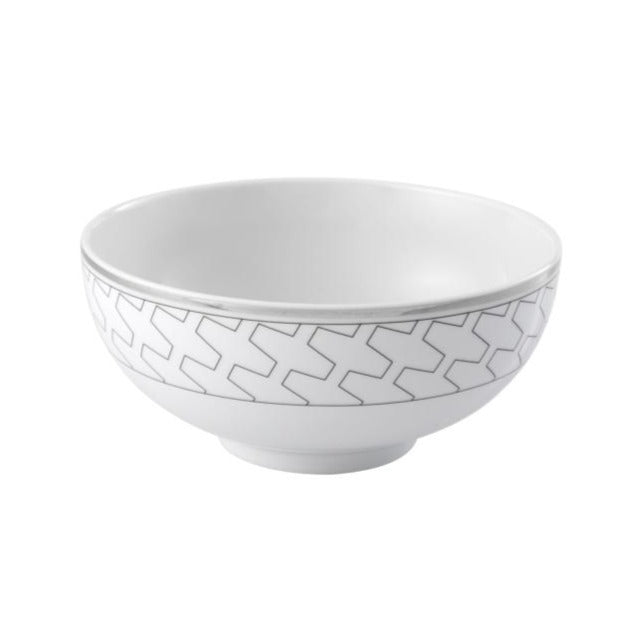 The Trasso Dinnerware by Vista Alegre is a white ceramic bowl featuring a subtle light gray geometric pattern around the rim, elegantly displayed against a plain white background.