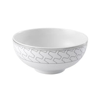 The Trasso Dinnerware by Vista Alegre is a white ceramic bowl featuring a subtle light gray geometric pattern around the rim, elegantly displayed against a plain white background.
