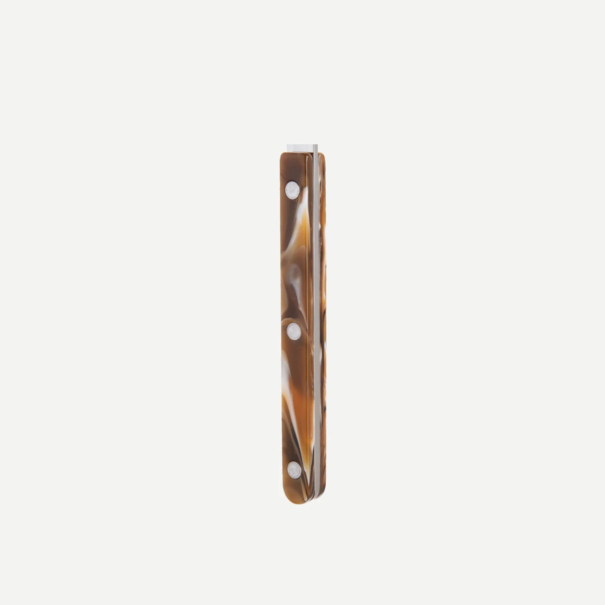 A long, rectangular Sabre Bistrot Flatware 5 Piece Set - Buffalo cutlery piece with a brown marbled handle featuring three evenly spaced round white holes, shown against a plain white background.