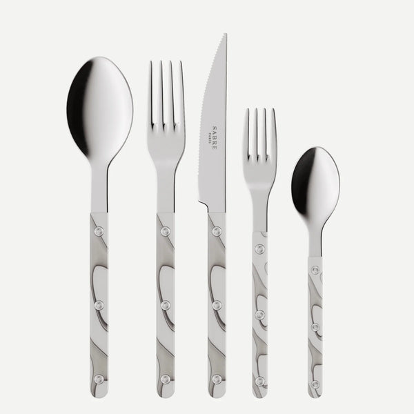 The Sabre Bistro Dune Flatware 5 Piece Setting features 18/10 stainless steel cutlery with polished heads and white-gray marbled handles, including a tablespoon, dinner fork, steak knife, salad fork, and teaspoon in classic bistro style.