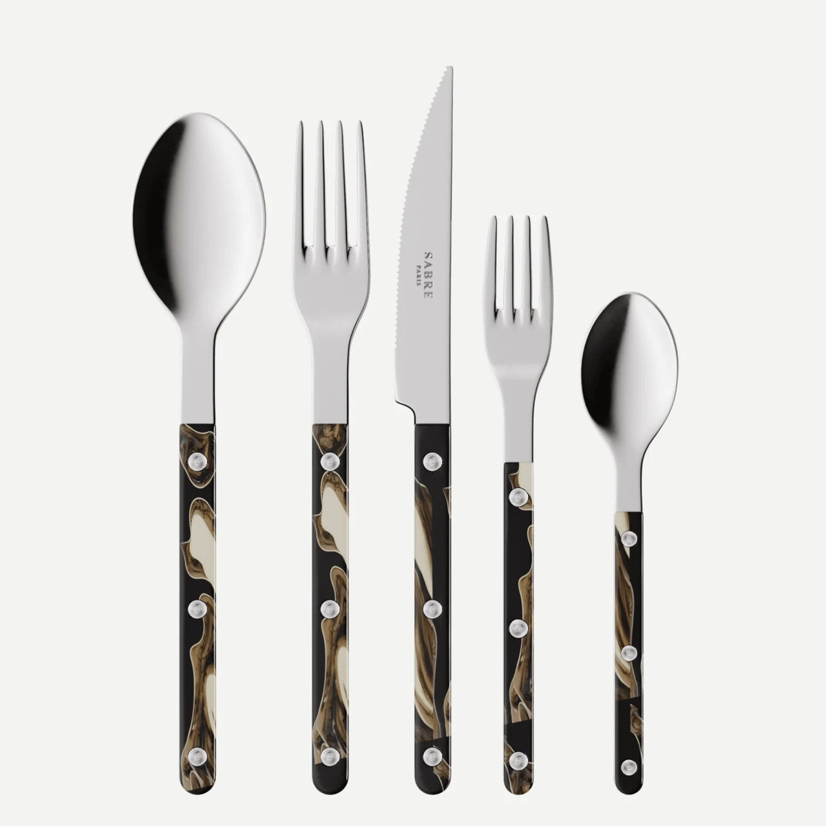 The Sabre Bistro Dune Flatware 5 Piece Setting includes a tablespoon, dinner fork, steak knife, salad fork, and teaspoon with glossy black and brown marbled handles and silver rivets, crafted from 18/10 stainless steel for French bistro flair.