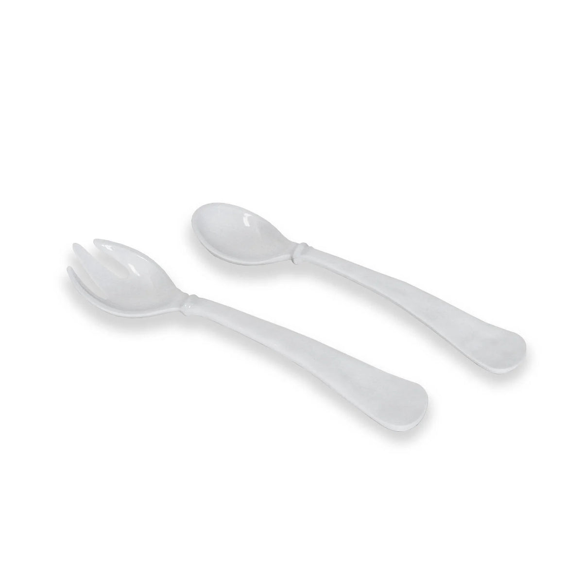 The Beatriz Ball Vida Havana Salad Servers in white—featuring a spoon and a three-tined spork—rest on a white background. These decorative, durable servers are dishwasher safe for easy cleaning.
