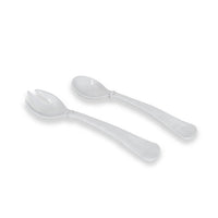 The Beatriz Ball Vida Havana Salad Servers in white—featuring a spoon and a three-tined spork—rest on a white background. These decorative, durable servers are dishwasher safe for easy cleaning.
