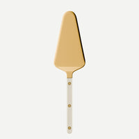 The Sabre Bistro Pearly Gold - Tart Server features a golden, triangular blade and a handle adorned with three small round rivets, drawing inspiration from classic French bistro style. It is displayed against a plain white background.