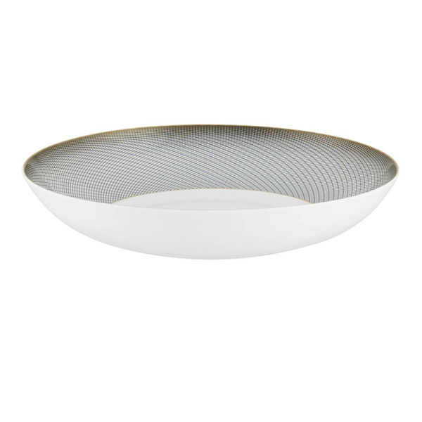 The Raynaud Oskar Dinnerware is a shallow, round white Limoges porcelain bowl with a subtle gold and gray geometric design on the inner rim and a smooth, plain exterior—showcasing classic elegance.