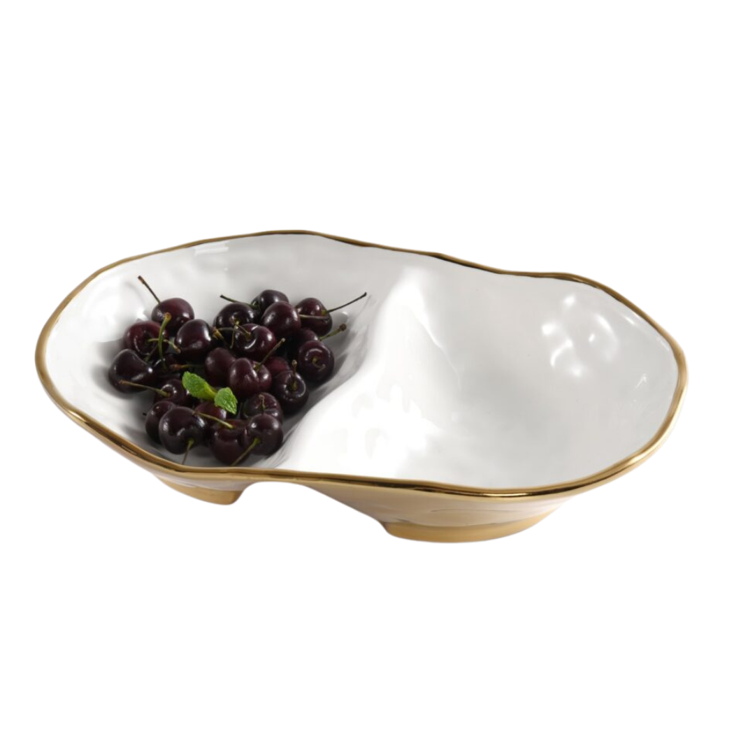 The PAMPA BAY Moonlight 2 Section Bowl features wavy edges, a gold titanium finish, and white porcelain. One section is filled with dark red cherries and a sprig of mint.