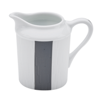 The Haviland Anthracite Infini Dinnerware Grey pitcher features white Limoges porcelain with a curved handle, spout, and a vertical dark gray stripe on one side, displayed against a white background.