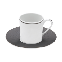 A Haviland Anthracite Infini Dinnerware Grey cup with a thin gray rim sits on a matching saucer featuring a dark gray, textured radiating pattern. Both are crafted from Limoges porcelain, set against a plain white background.