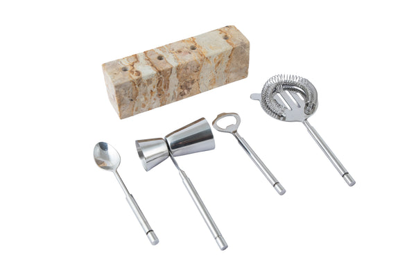 The Go Home Carpri Bartool Set 5pc includes a bar spoon, double jigger, bottle opener, and cocktail strainer on a stylish marble stand—ideal for cocktail lovers and perfect for any modern setup.