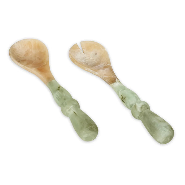 The Beatriz Ball Resin Giada Salad Server Set – Jade Swirl features a spoon and fork with pale green and beige marbled handles, reminiscent of jade-inspired tableware, elegantly placed side by side on a white background.