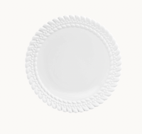The Babylone Dinnerware by Christofle is a white porcelain dinner plate from France, featuring a textured braided rim, shown on a plain white background.