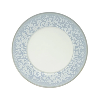 The Song Ocean Dinnerware plate by Jaune De Chrome features a round ceramic design with a white center and wide light blue border speckled with white dots, inspired by French dinnerware and shown from above on a white background.